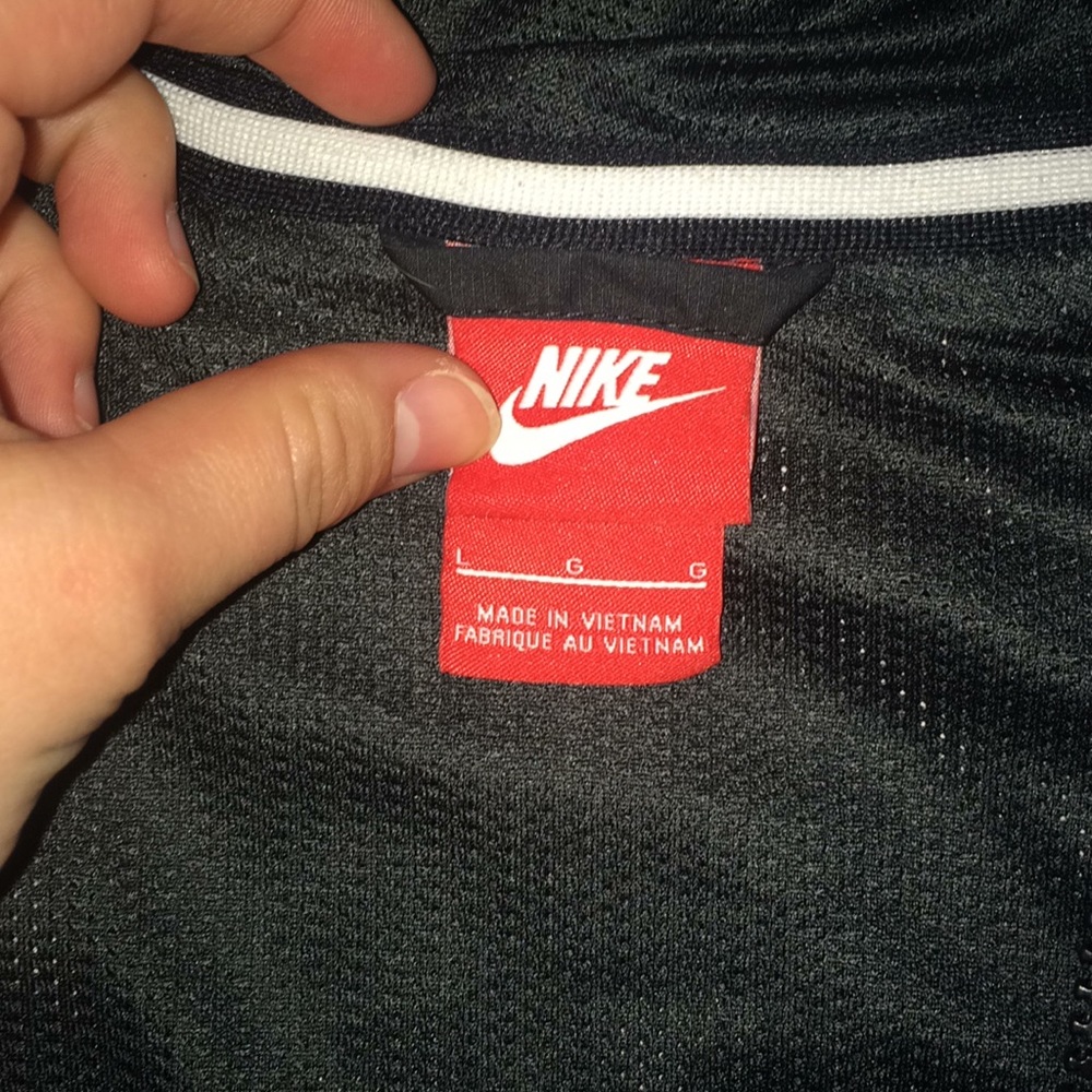 Nike windbreaker size L but fits like a small